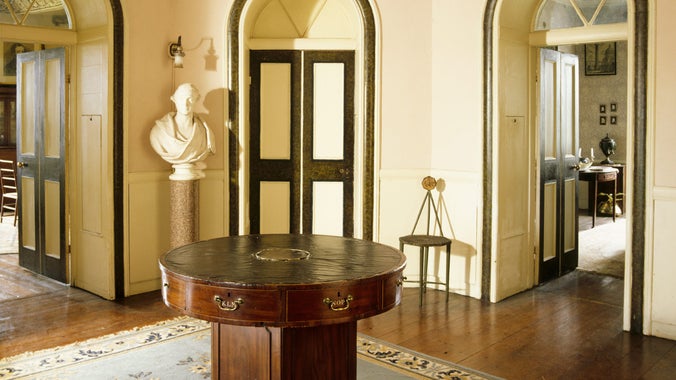 The Octagon, showing rooms radiating from centre with late 18th century mahogany rent table in the centre, prior to redecoration.